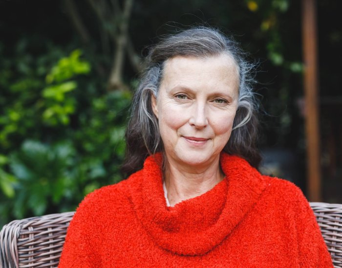 Portrait of happy senior caucasian woman looking to camera and smiling in garden